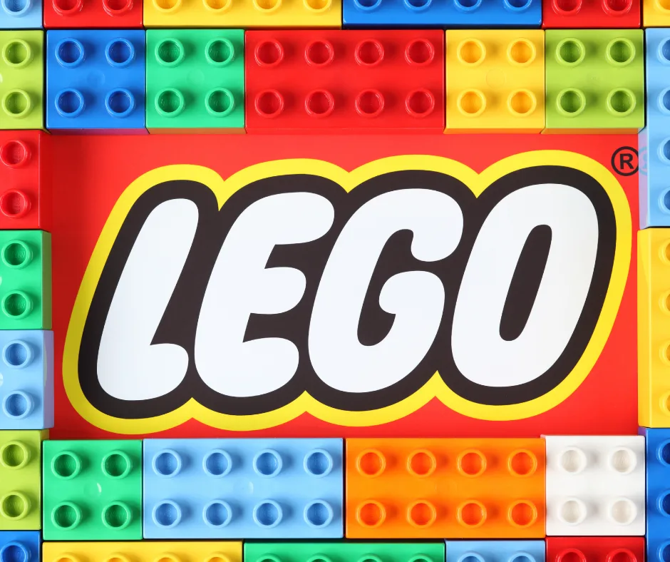 gifts for lego lovers featured image with lego brand across some lego blocks