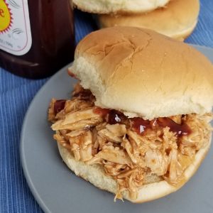Featured image showing the finished slow cooker bbq chicken.