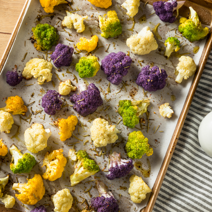 This easy Roasted Broccoli and Cauliflower recipe is a great way to serve vegetables with a crunchy, flavorful texture that kids love!