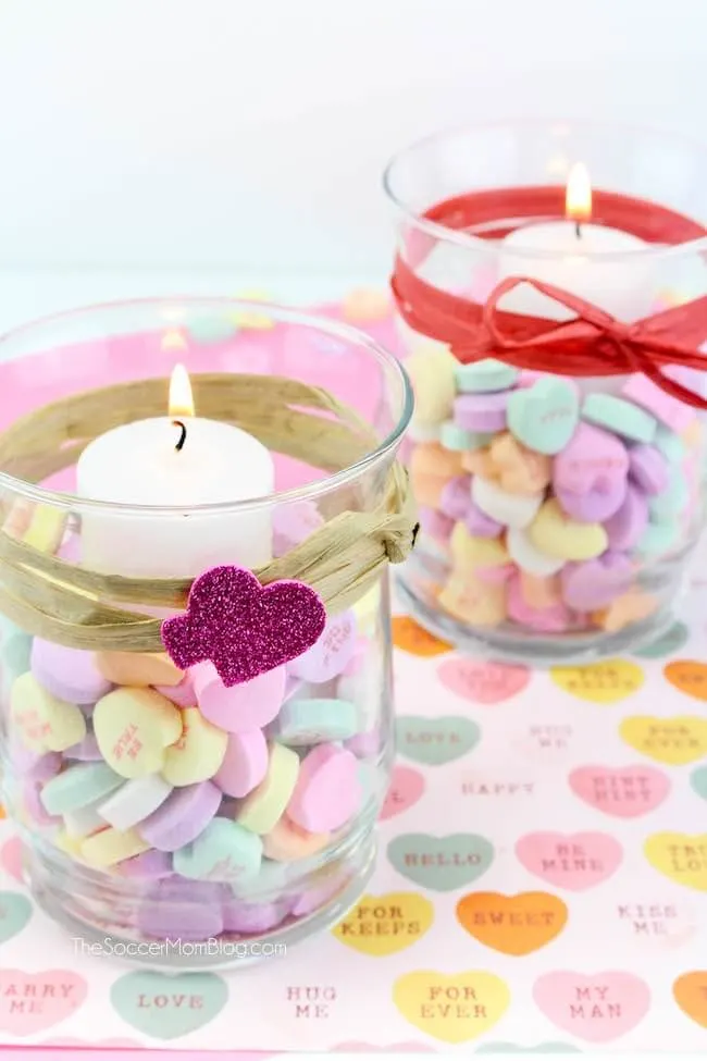 Votive candle holders filled with Conversation hearts
