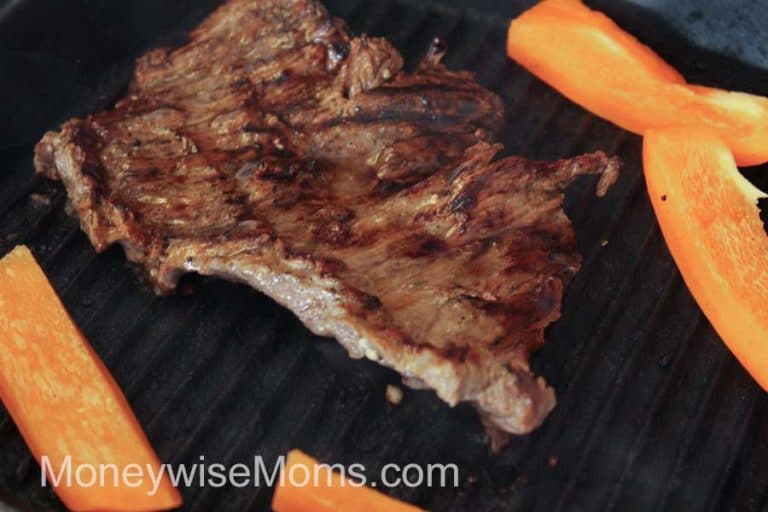 The easy homemade cilantro lime marinade makes Beef Fajitas full of flavor! Cilantro lime steak fajitas are the perfect grilling recipe for the summertime. You'll love how easy it is to make beef fajitas on the grill. They're a big part of our meal plans in the summertime. 