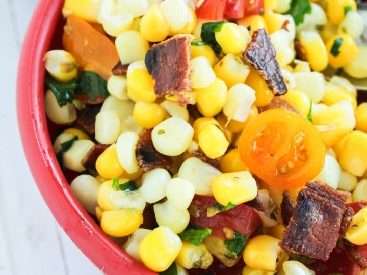 Looking for a new way to serve up some vegetable side dishes? This delicious corn salad with bacon is quick, easy, and delicious. The whole family will love this easy vegetable salad. It's a great picnic recipe as well. 