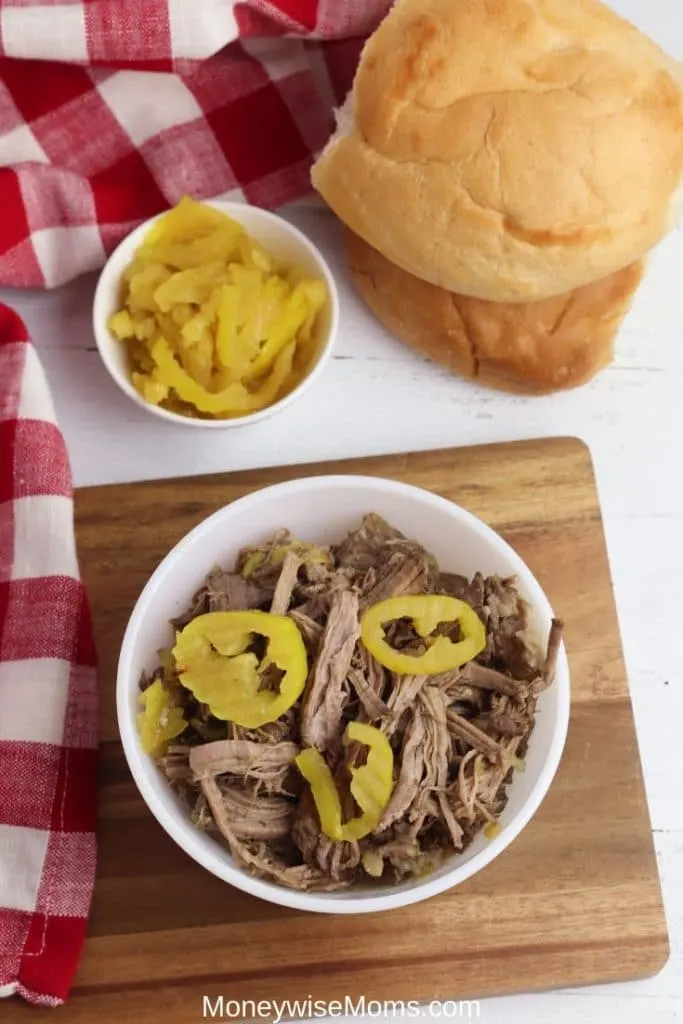Italian beef with banana peppers in a white bowl