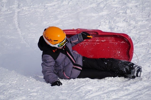 Boy sledding in the snow