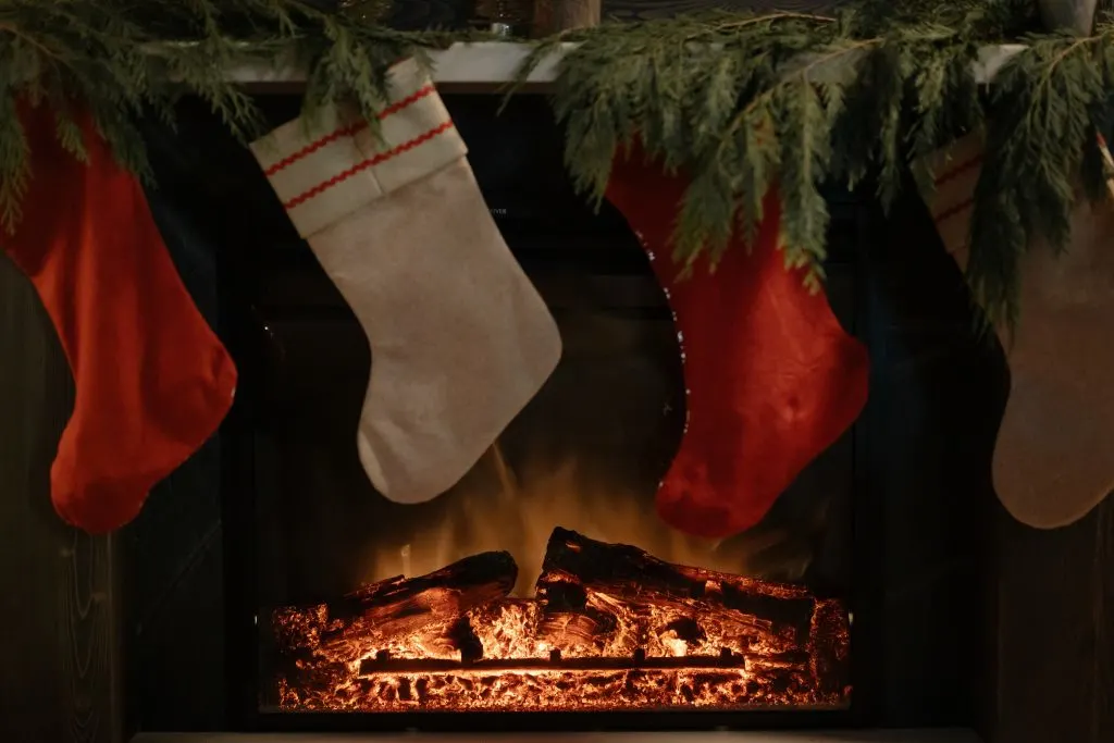 stockings hung over lit fireplace