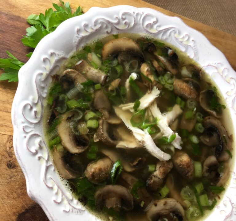 Featured image of finished chicken marsala soup in a beautiful white bowl.