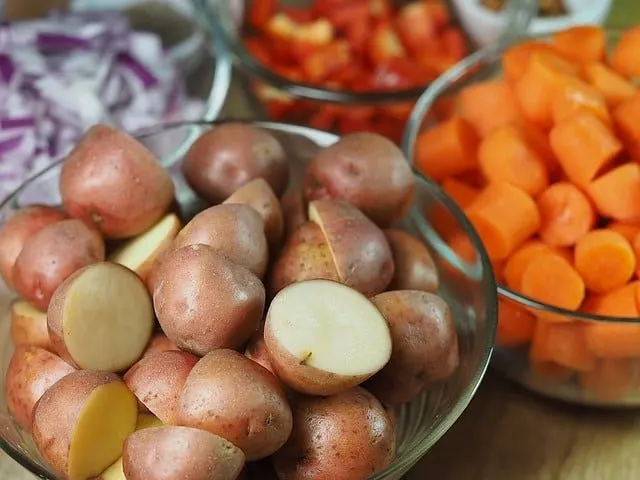 potatoes and vegetables in glass bowls