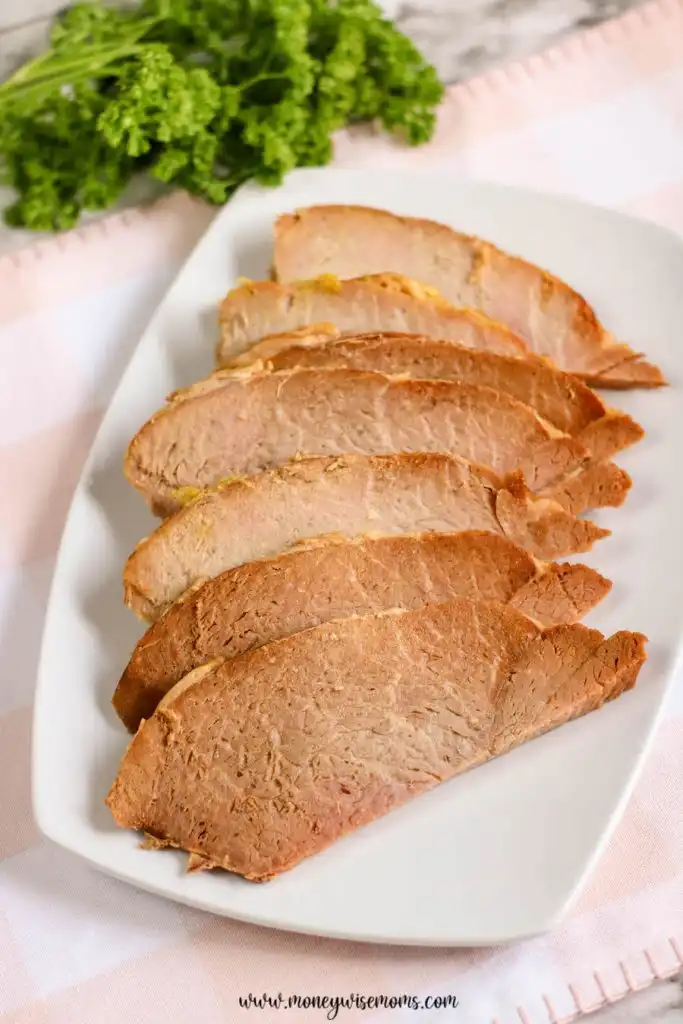 A plate full of the sliced ham ready to be enjoyed.