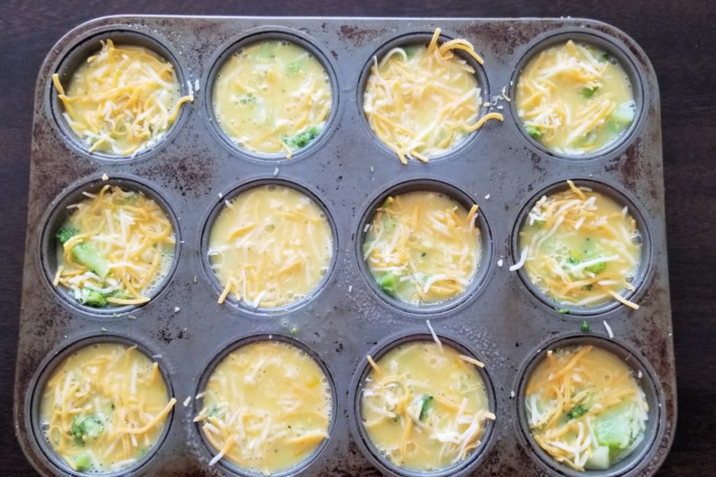 Add scrambled eggs to each cup on top of the vegetables and cheese - easy and healthy egg muffin cups