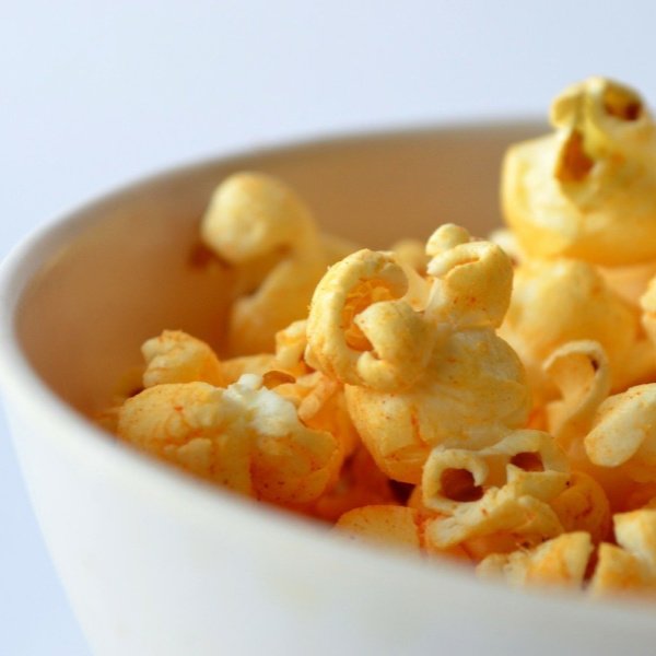 Cheese popcorn in a white bowl