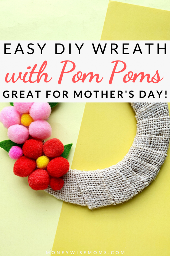 This beautiful pom pom wreath makes a great Mother's Day gift. It's a cute, DIY project you can make at home with very little in materials or cost. This is a simple Mother's Day wreath that you can customize! 