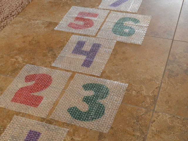 bubble wrap with numbers making a hopscotch on the rug