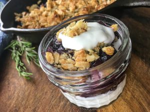 A close up view of the finished blueberry crisp ready to serve.