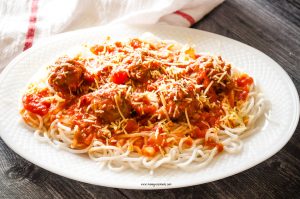 Featured image showing a platter of spaghetti and baked ground turkey meatballs ready to eat.