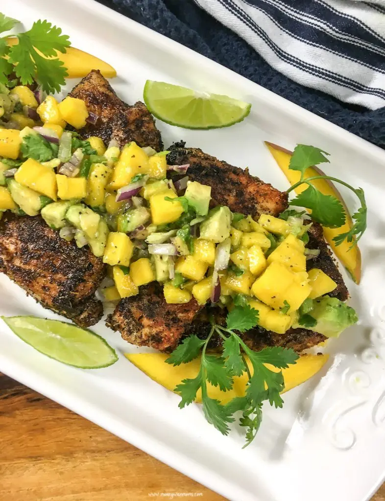This easy homemade salsa is delicious, perfect for a snack with chips, topping chicken, fish, or even pork! Try out this zesty mango avocado salsa today!