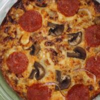 Featured image showing the finished pizza frittata ready to slice and serve.