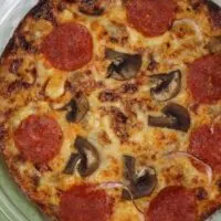 Featured image showing the finished pizza frittata ready to slice and serve.