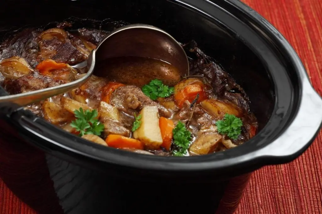 beef stew meal in black crock pot