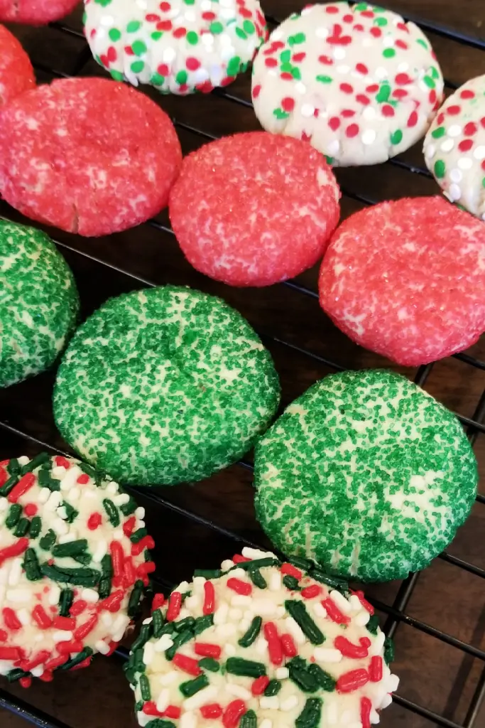 Assorted sugar cookies on cooling rack