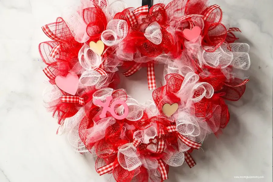 Featured image showing the finished dollar tree valentine wreath ready to hang up or share!