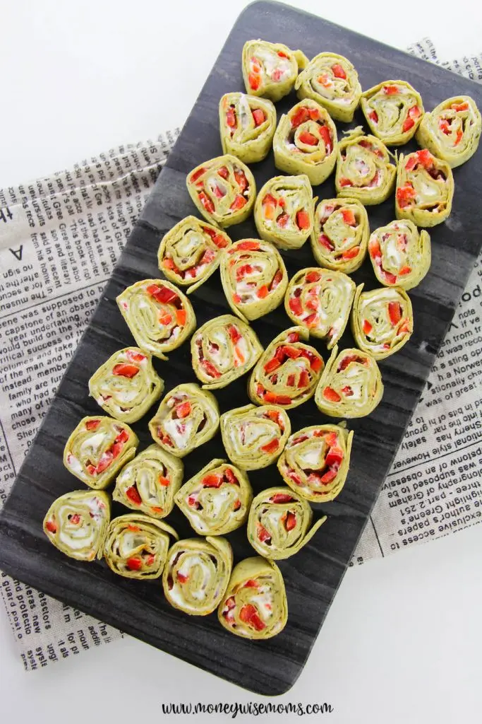 A full tray of the finished spinach and pepper cream cheese pinwheels. 