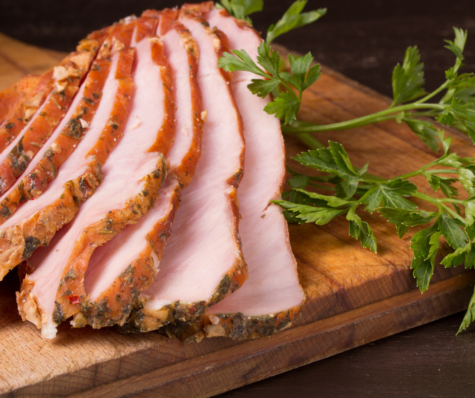 Sliced ham on a cutting board ready to eat. 