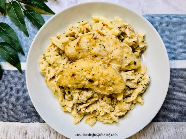 Featured image showing a plate full of the finished slow cooker creamy chicken ready to eat.