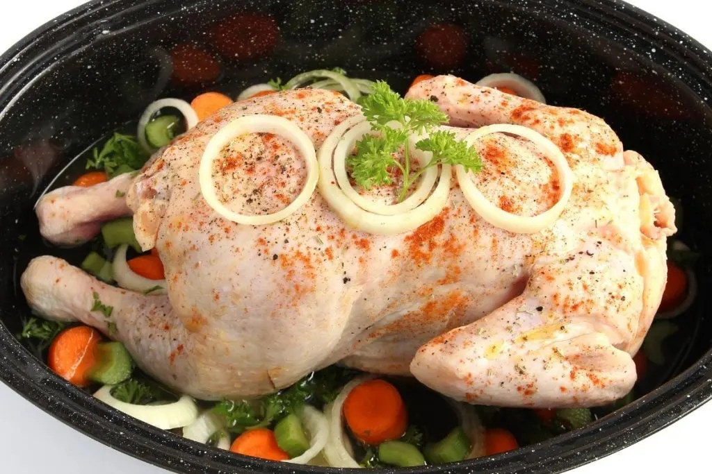 whole chicken in crock with carrots celery and onions