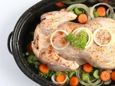 raw chicken and vegetables in crockpot