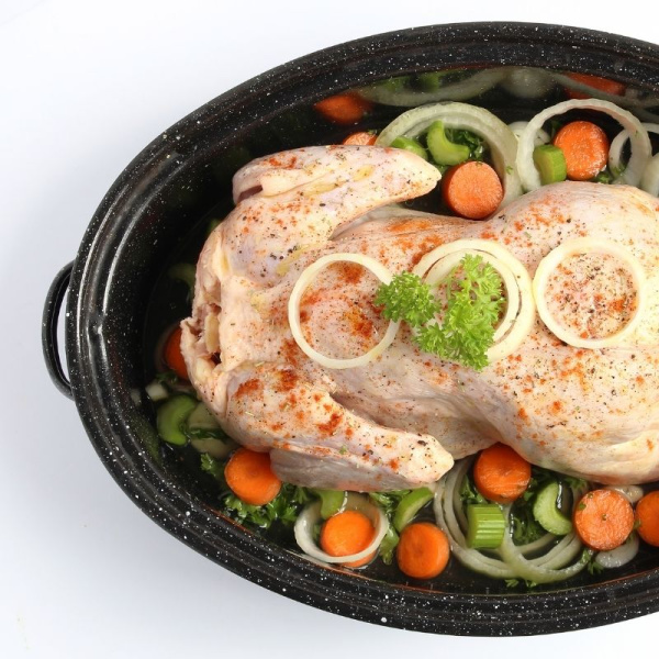 raw chicken and vegetables in crockpot