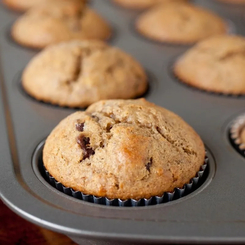 whole wheat muffins in metal tin