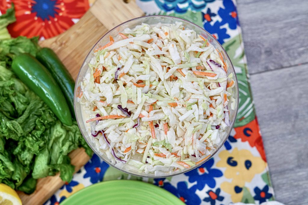 A bowl full of the finished easy cole slaw recipe ready to serve. 