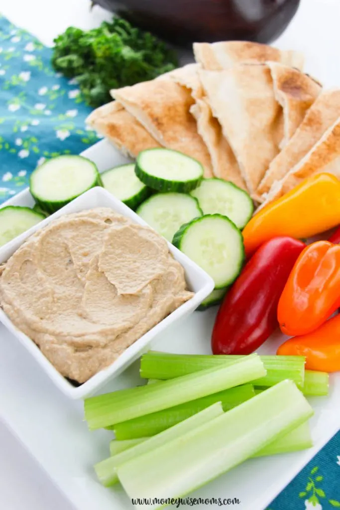 The finished recipe for roasted eggplant dip ready to serve with pitas, veggies, and more. 