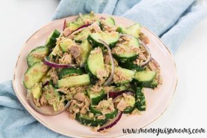 featured image for cucumber tuna avocado salad piled up on a plate.