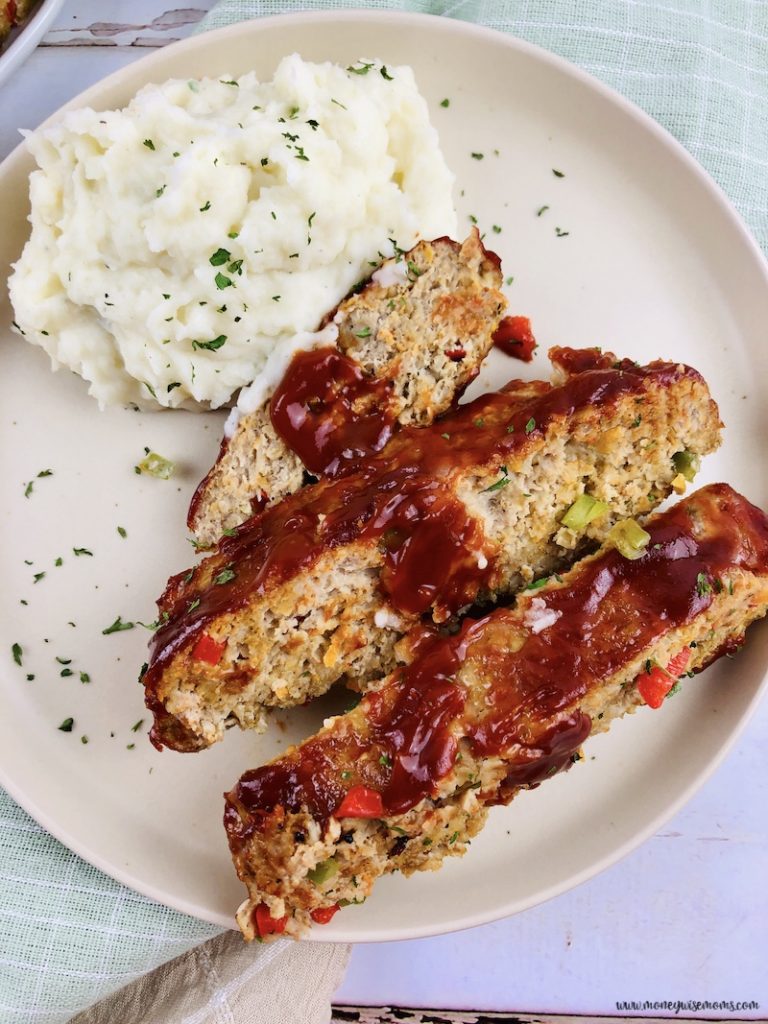 a plate with meatloaf with no breadcrumbs and mashed potatoes. 