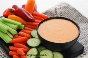 featured image showing the finished creamy roasted red pepper dip.