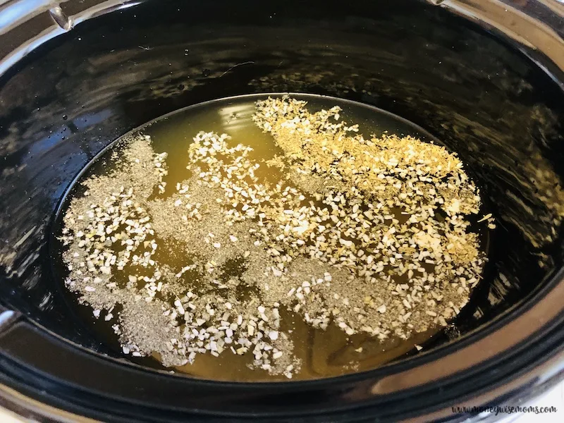 Broth and spices in the crockpot. 