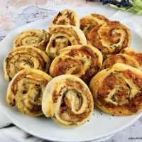 Featured image showing the finished baked ham and cheese pinwheels.