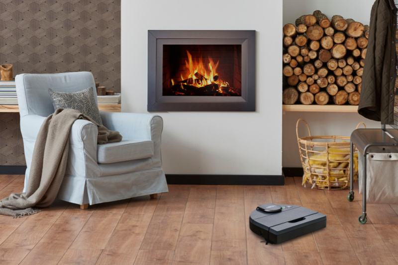 living room with chair and fireplace - Neato robotic vacuum - ways to prep your home this fall