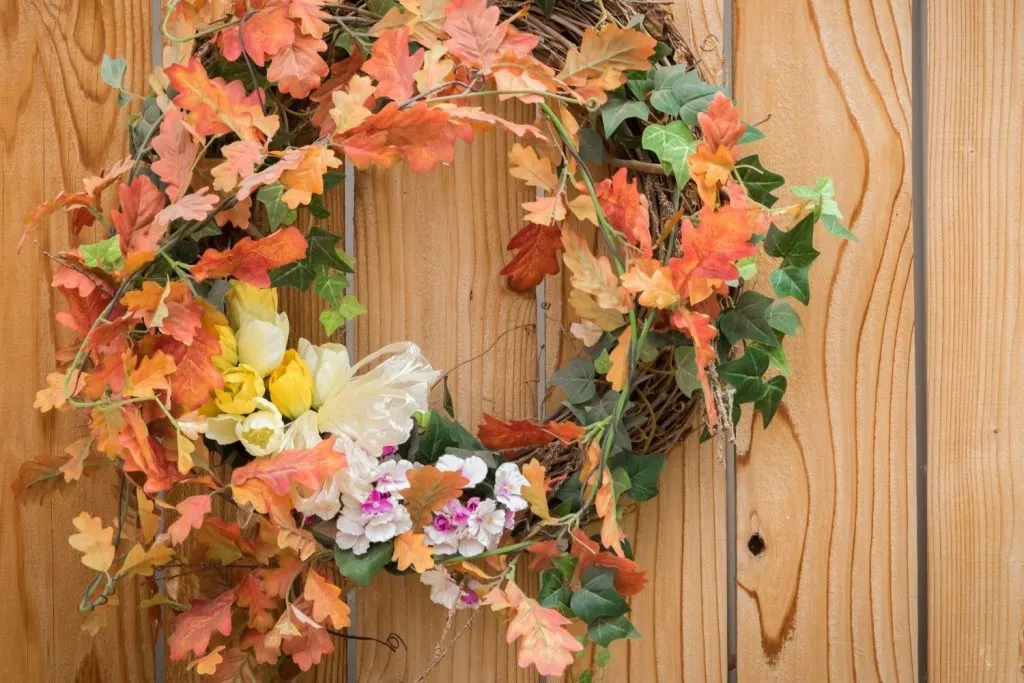 colorful fall wreath on indoor wall - Thanksgiving wall decoration ideas
