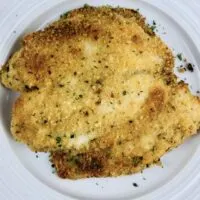 finished recipe for parmesan crusted tilapia on a plate ready to serve