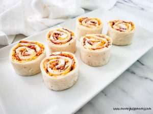 Featured image showing the finished cheddar bacon ranch pinwheels ready to eat