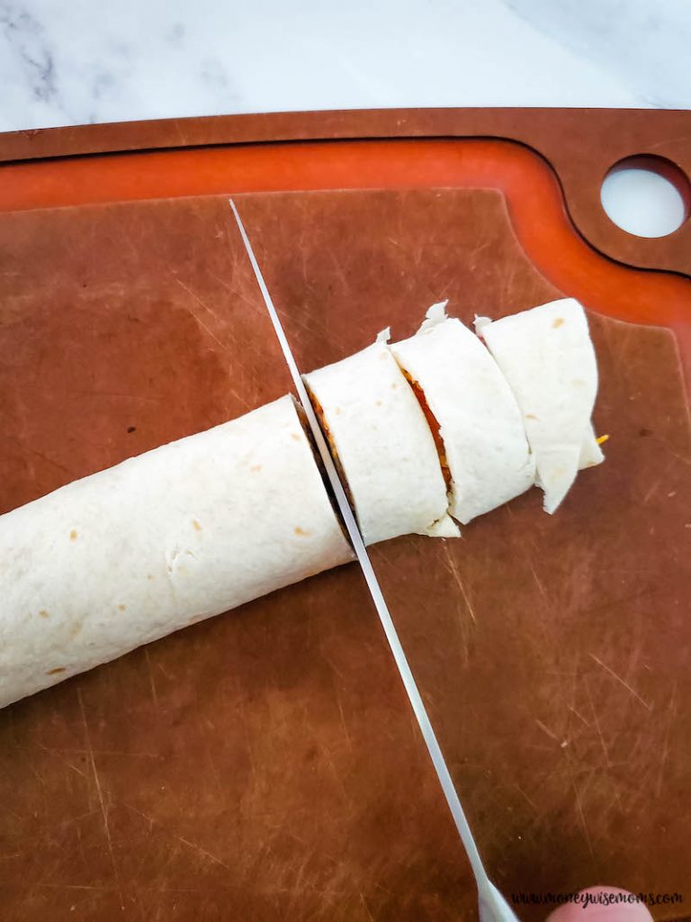 tortillas being cut into slices
