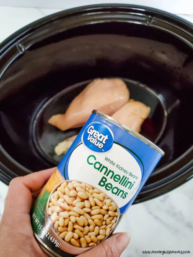 beans being added to crockpot. 