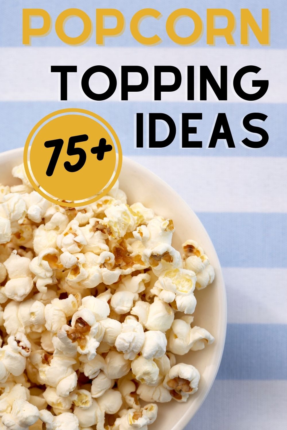 popcorn in white bowl on blue striped tablecloth