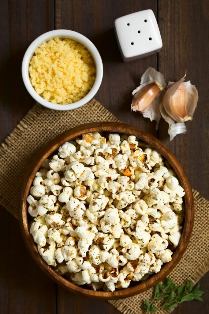 Savory popcorn in wooden bowl - popcorn seasoning ideas