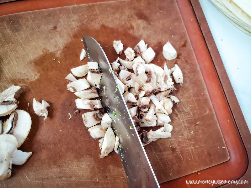 mushrooms being chopped. 