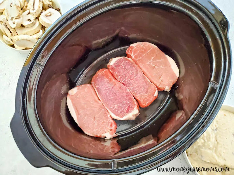 pork chops in the bottom of the crockpot. 