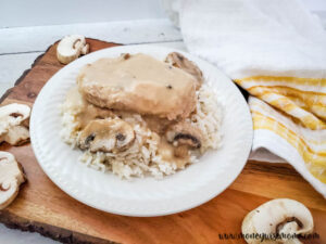 Featured image showing finished easy slow cooker pork chops recipe.