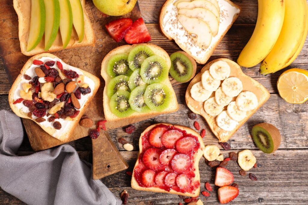 Breakfast toast ideas with nuts kiwi strawberries bananas and apples